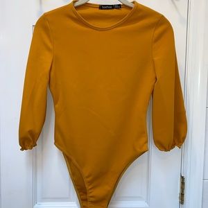 Mustard long sleeve bodysuit.